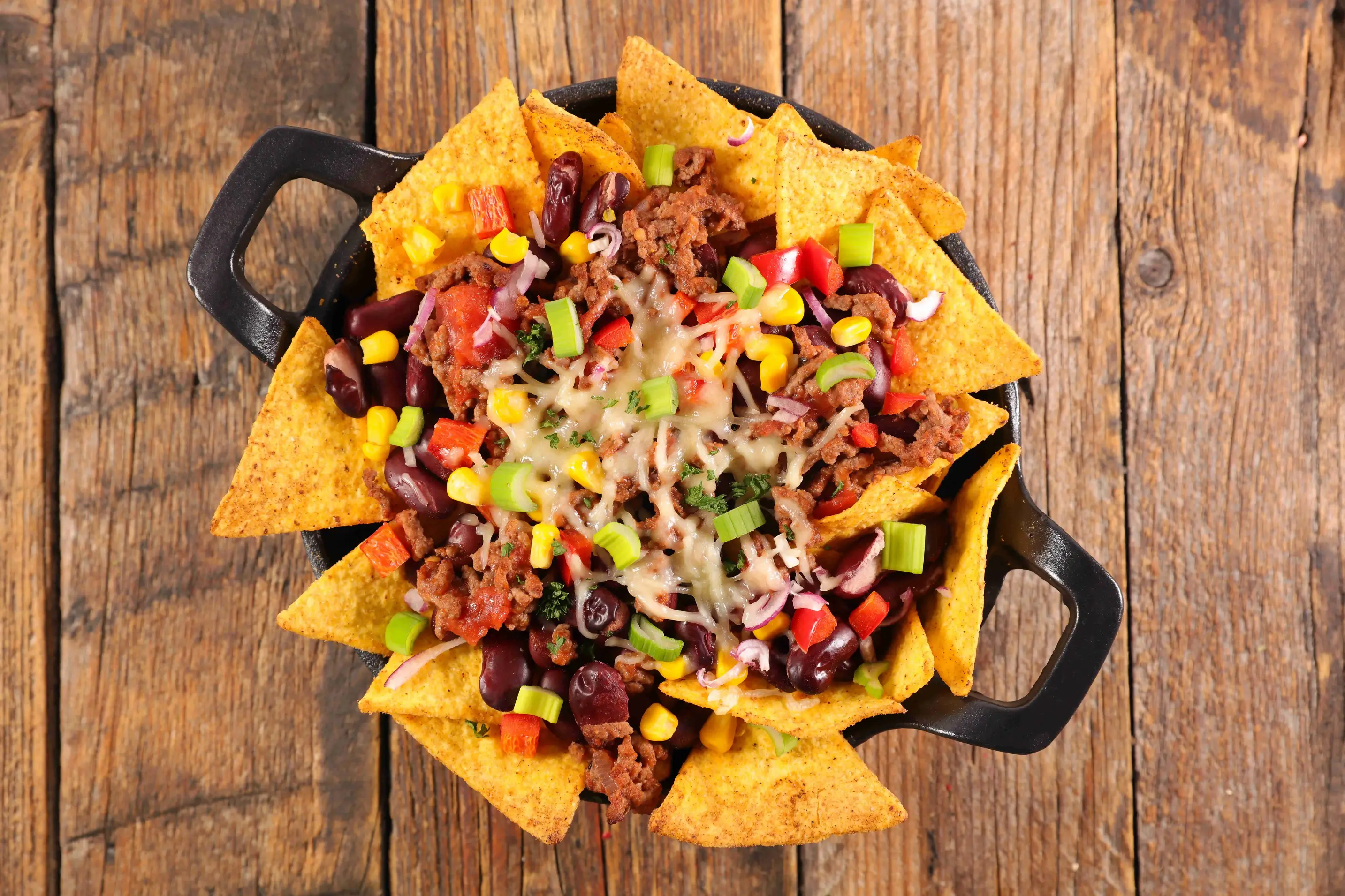 A huge bowl of loaded nachos